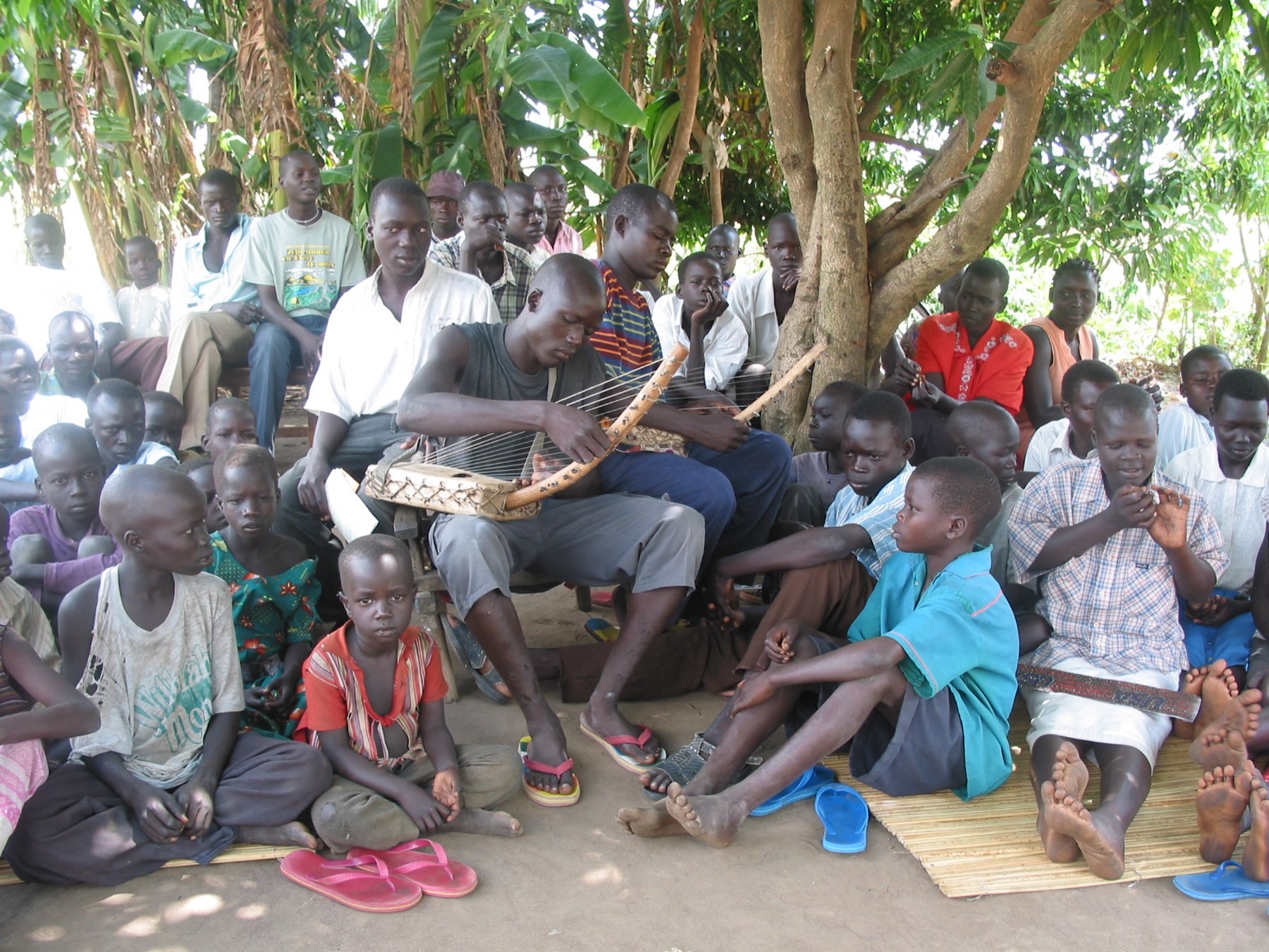 Large group around a musician large group around a musician