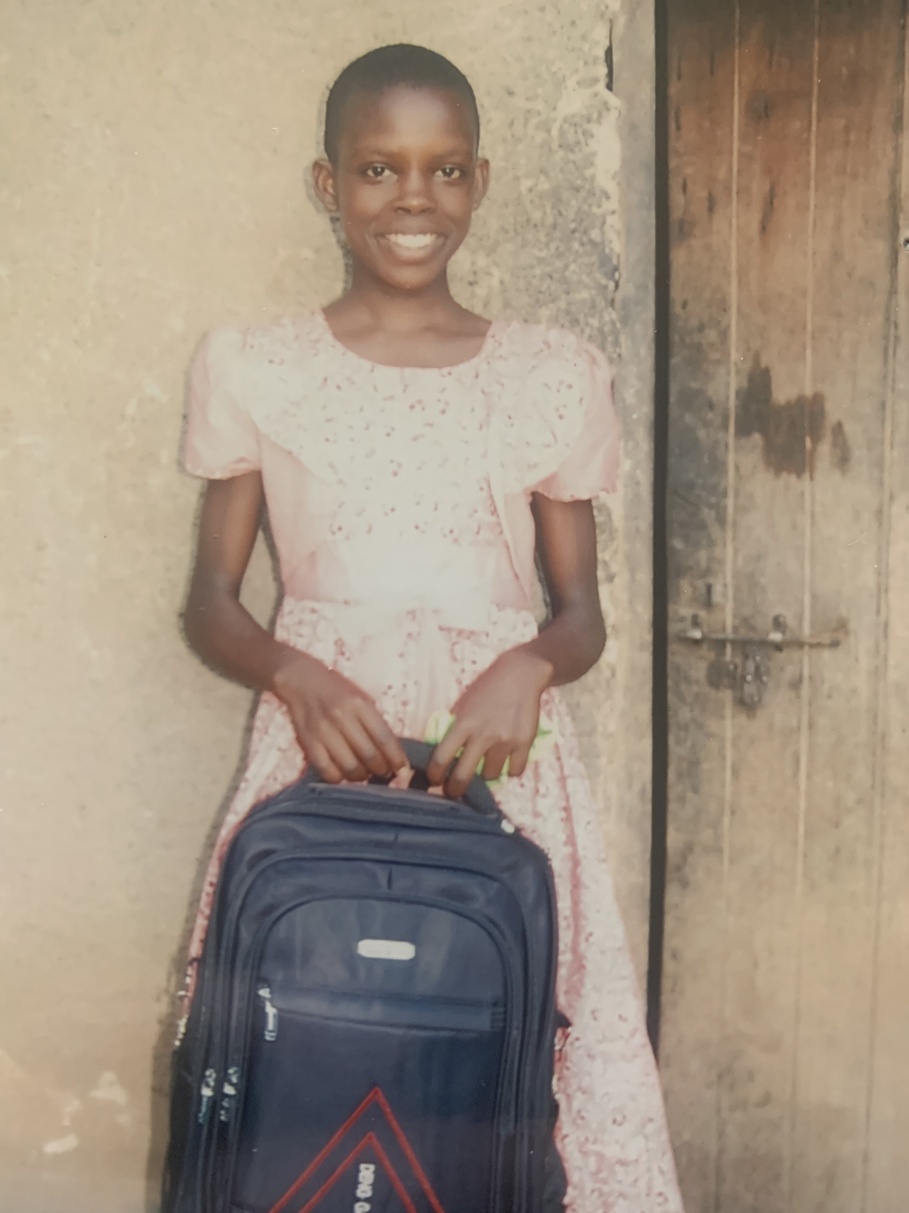 female student holding a backpack