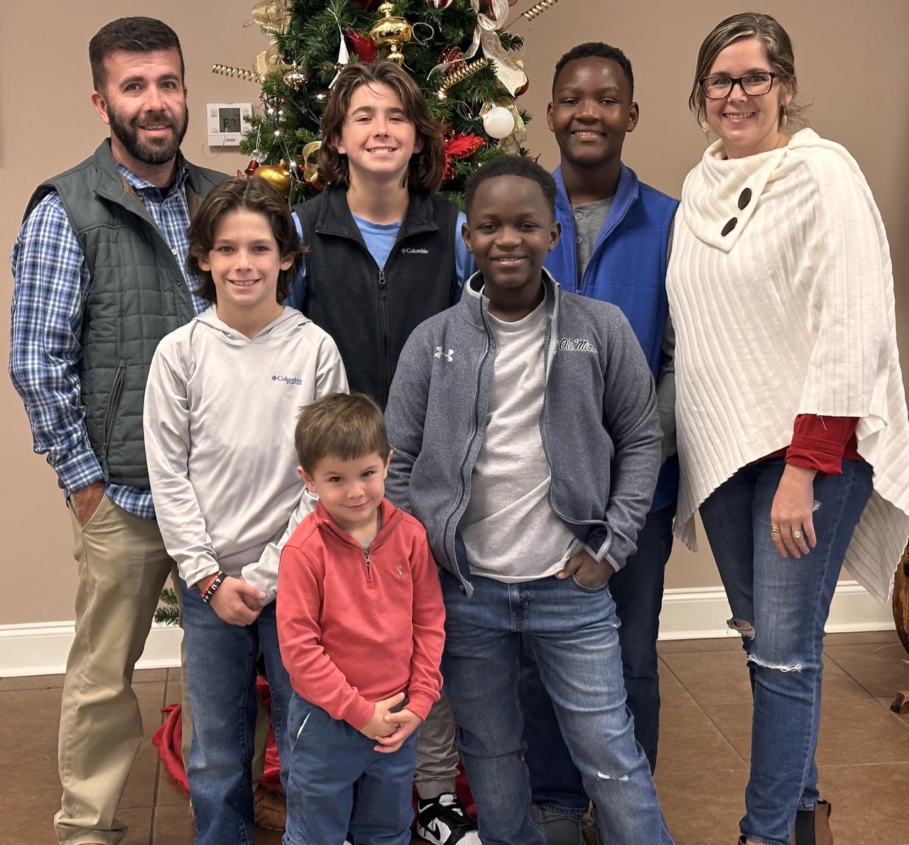 Michael and family Mom dad and children posed