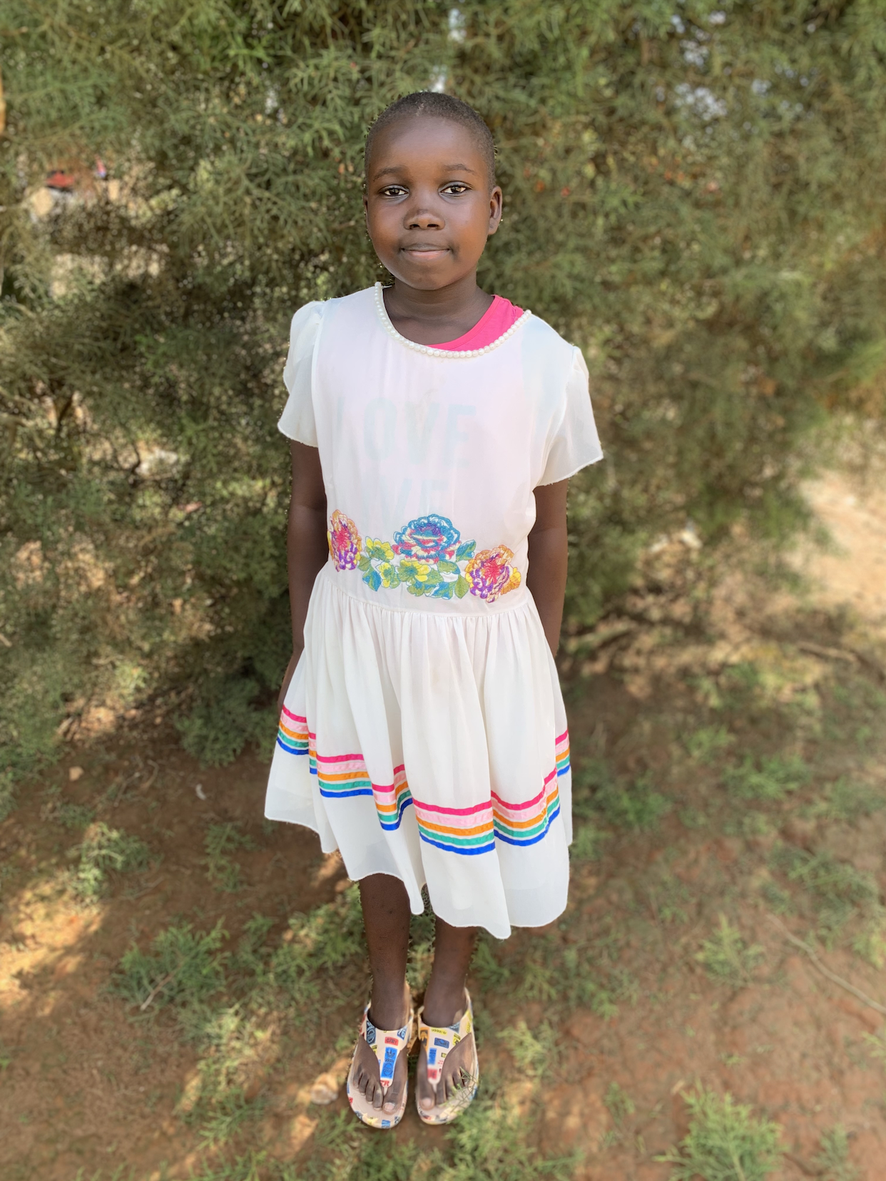 Nandi wearing white dress