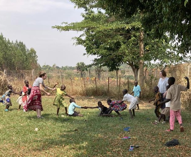 Interns playing with children