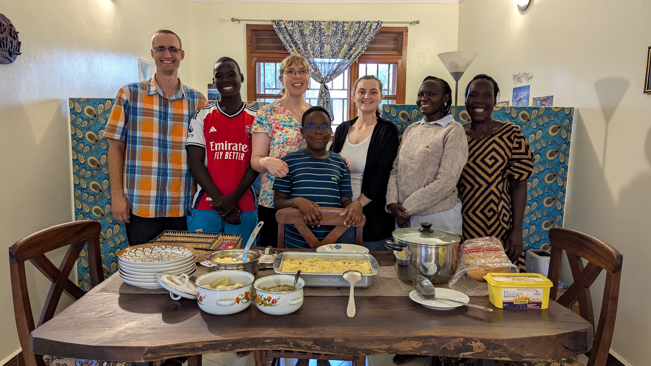 Group of western friends around dinner table