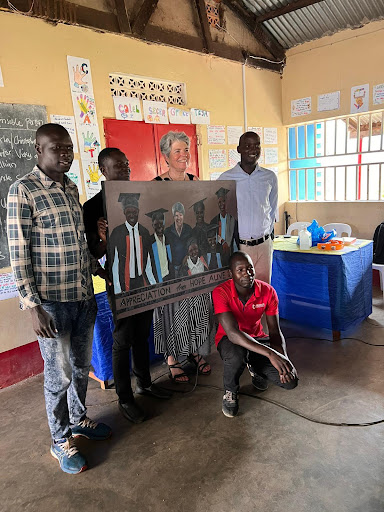 Students present a painting to Catharine