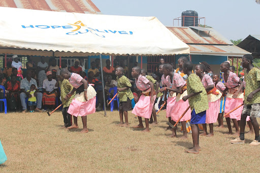 students in pink doing a dance