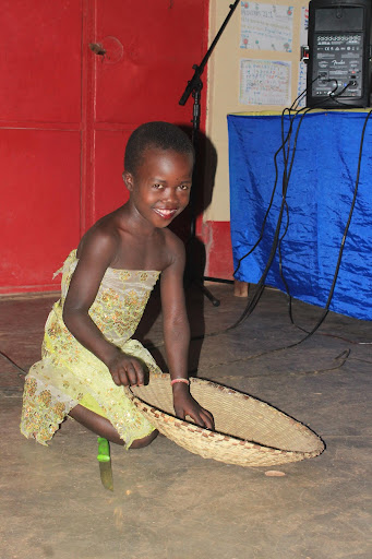 Small girl in a yellow dress with a basket