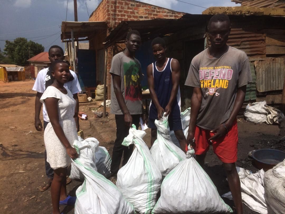 Students hauling bags of charcoal