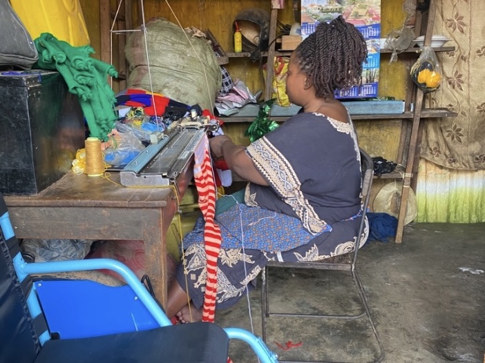Juliet Knitting woman sitting at knitting machine