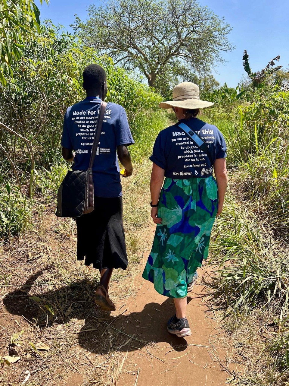 rural path and rear view of two women walking 