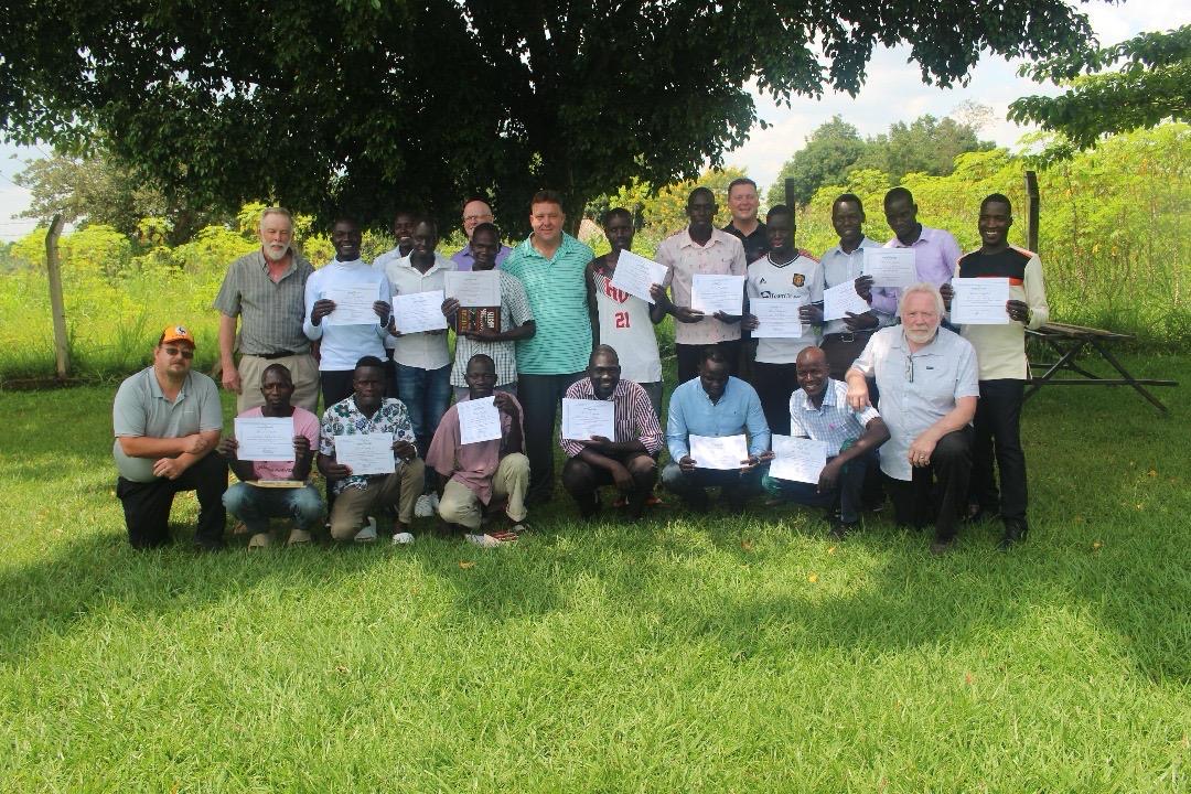 Group of men holding certificates