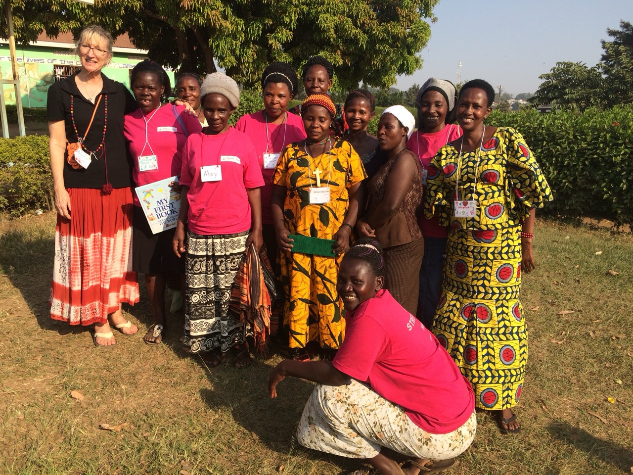 American woman with group of Ugandans